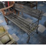 A Wooden Slatted Cast Iron Ended, Garden Bench, 119cms Wide