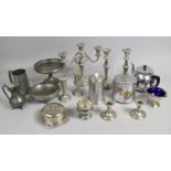 A Collection of silver plated items to include three branch candelabra, two candlesticks, pewter