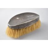 A Silver Mounted Gents Hairbrush. London Hallmark