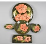 A Collection of Five Moorcroft Coral Hibiscus Plates and Dishes