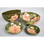 A Collection of Four Moorcroft Coral Hibiscus Bowls, Largest 15.5cms Diameter