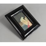 A Reproduction Ebonized Photo Frame Containing Section of Chinese Actor Print, 24x19cms