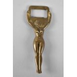 A Novelty Brass Bottle Opener in the Form of Standing Female Nude, 10cms High