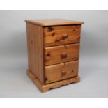 A Modern Pine Three Drawer Bedside Chest, 43cms Wide