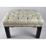 A Button Upholstered Footstool, 55cms by 37cms