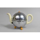 A 1930's WMF Bauscher Teapot with Cream Glazed Ceramic Body Encircled by Chromed Cover, with