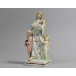 An Early 19th Century Staffordshire Pearlware Figure Group, "Charity", 18.5cm high