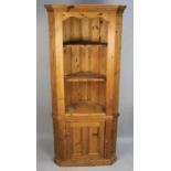 A Pine Freestanding Corner Cabinet with Three Shelves Over Cupboard Base, 70cm wide