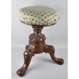A Victorian Swivel Topped Piano Stool with Carved Mahogany Tripod Base