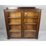 A Mahogany Display Cabinet with Galleried Top Above Double Glazed Doors Enclosing Three Shelves,