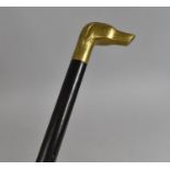 A Late 20th century Ebonized Walking Cane with Brass Dogs Head Handle, 97cms Long