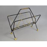 A 1970's Black and Yellow Folding Magazine Rack