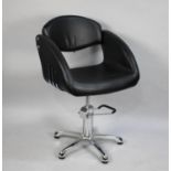 A Chrome and Black Leather Effect Barbers Chair