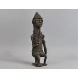 A Heavy Cast Bronze African Benin Figure, Seated Gent with Pipe, 25.5cm high