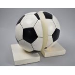 A Pair of Modern Novelty Bookends in the Form of a Football, 16cm high