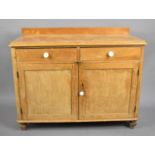 A Galleried Two Drawer Side Cabinet with Cupboard Base, 105cm wide