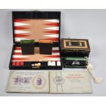 A Pair of Vintage Folding Binoculars, Cash Tin, Two Cigarette Pad Albums and a Travelling Backgammon