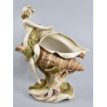A Large Royal Dux Centrepiece in the Form of a Maiden Resting on a Conch Shell, 38cms High