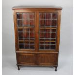 An Edwardian Lead Glazed Bookcase with Cupboard Base, 90cms Wide