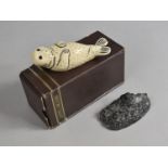 Two Reproduction Inuit Cast Resin Studies of Seal and Seal Beside Figure in Kayak