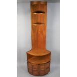 A 1960's Nathan Teak Modular Corner Cabinet Having Three Shelves Over Cupboard Base