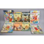 A Collection of Eight Rupert Annuals