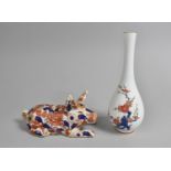 An Oriental Study of a Recumbent Pig Decorated in the Imari Palette Together with a Japanese