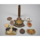 A Collection of Militaria to include Badges, Spent Rounds, Medallions, Etc