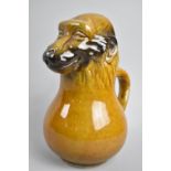 A Late 19th/20th Century Novelty Treacle Glazed Jug in the Form of a Monkey, 22cm high