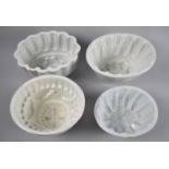 A Collection of Four White Glazed Victorian and Edwardian Jelly Moulds