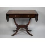 A Reproduction Mahogany Drop Leaf Sofa Table with Tooled Leather Panels, 88cms Wide