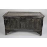 An 18th Century Oak Coffer Chest with Lift Top, Carved Front Panel in the Naive Style, 120cms Wide
