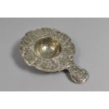 A Late 19th Century Continental Silver Tea Strainer of Shaped Form with Handle Having Repousse