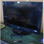 An LG 32" TV with Remote