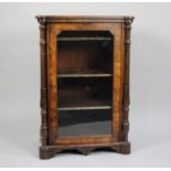 A Victorian Walnut Music Cabinet with Turned Pilaster Decoration and Three Named Shelves