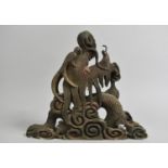 An Ornamental Oriental Carved and Pierced Wooden Support in the Form of a Dragons Head, 30cms High