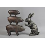 A Modern Bronze Effect Resin Sculpture, Tower of Three Graduated Pigs, together with a Cast Resin