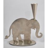 A Brushed Stainless Steel Candlestick in the Form of an Elephant, 21cms High