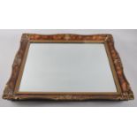 A Decorative Wall Mirror with Scrolled Frame, 59x49cm