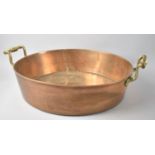 A Heavy Circular Copper Cooking Pan with Brass Handles, 36cms Diameter