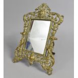 A Pierced Carved Brass Easel Back Mirror, 26cms High