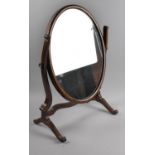 A Mahogany Oval Swing Dressing Table Mirror, 57cm high