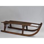 A Vintage Wooden Sleigh with Wrought Iron Mounts, 97cms Long