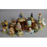 A Collection of 14 Various Beswick Beatrix Potter Figures together with a Tree Trunk Stylised Stand