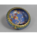 A Chinese Cloisonne Bowl Decorated with Rock, Blossoming Branches and Bird in Flight on Blue and