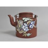 A Chinese Yixing Teapot with Applied Enamel Design Depicting Dragon in Scrolled Sky, 13cm high