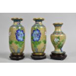 A Pair of Chinese Cloisonne Vases on Turned Wooden Stands Decorated with Blossoming Flowers on