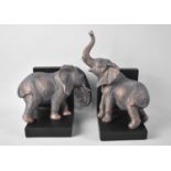 A Pair of Modern Novelty Bookends in the Form of Elephants Scratching Against Wall, Tallest 25cms