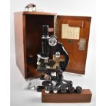 A Vintage Cased Monocular Microscope with Accessories and Lenses
