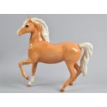 A Royal Doulton Palomino, Prancing Arab Type